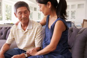 caregiver-comforting-senior-man
