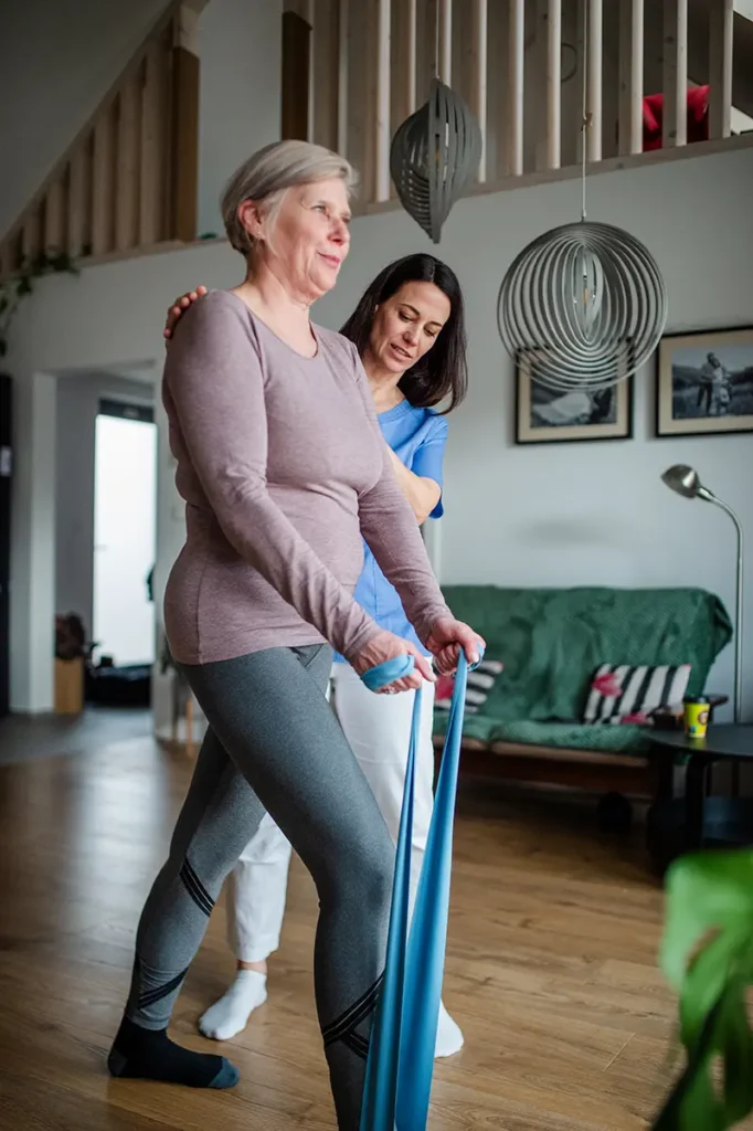 older lady a home with occupational therapist